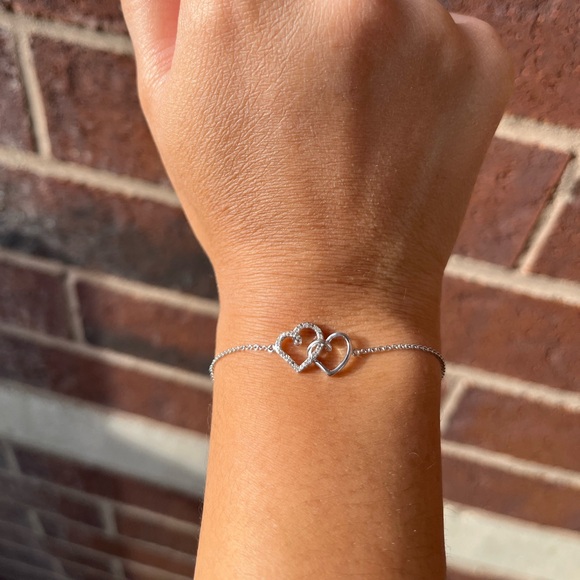 0.04 CT. T.W. Diamond Interlocking Hearts Bracelet in Sterling Silver - 6.75" - Picture 4 of 10